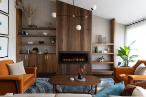 A mid century modern living room designed around a wood fluted fireplace.