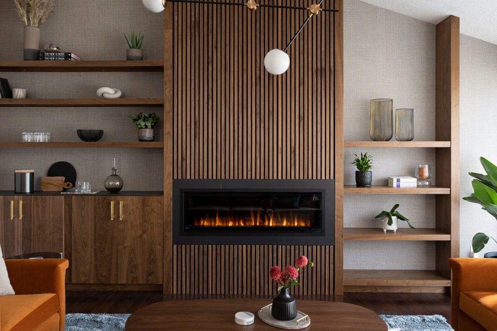 A unique living room with a fluted fireplace and modern wall shelving in dark wood.