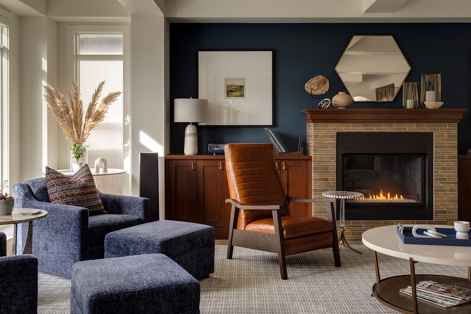 A Living room with a traditional brick fireplace and modern furnishings.
