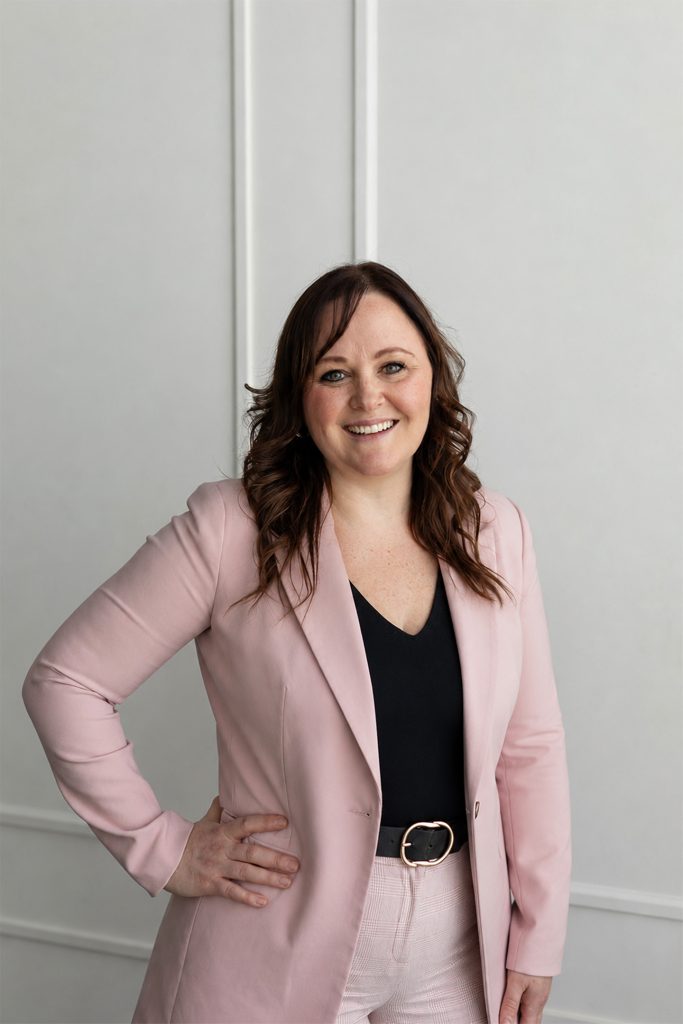 Professional headshot of a female operations manager at an interior design studio.