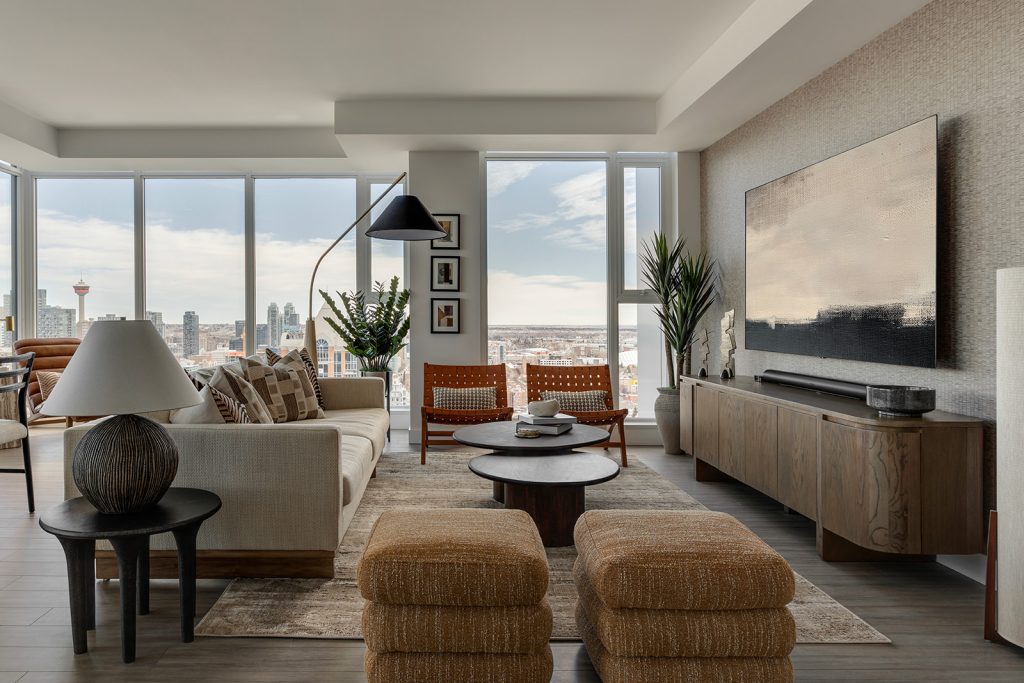 A downtown Calgary condo living room with Japandi style furniture and a view of the city.